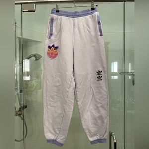 Adidas purple sweatpants w/multie color patch. Size small. Gently used.